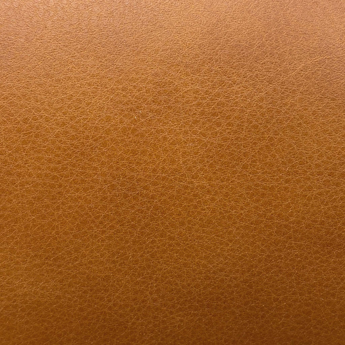 Close-up of the saddle brown grained leather used on the Dreamer 3 seater sofa