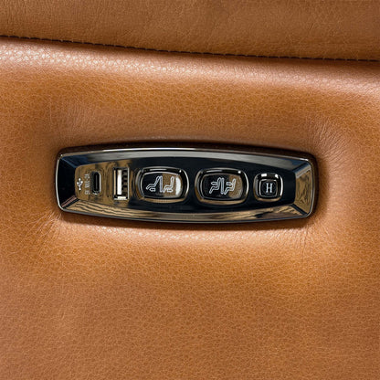 Close-up of the power recline and headrest control panel with USB port on the Dreamer leather sofa