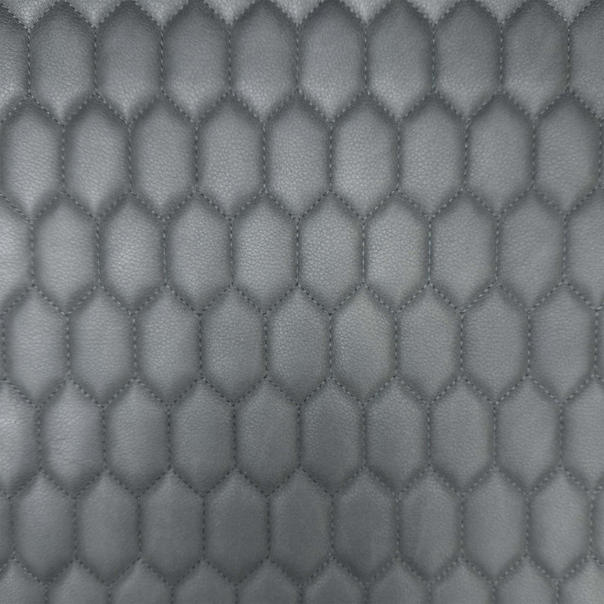 Close-up of the grey honeycomb stitched faux leather used on the Osaka dining bench