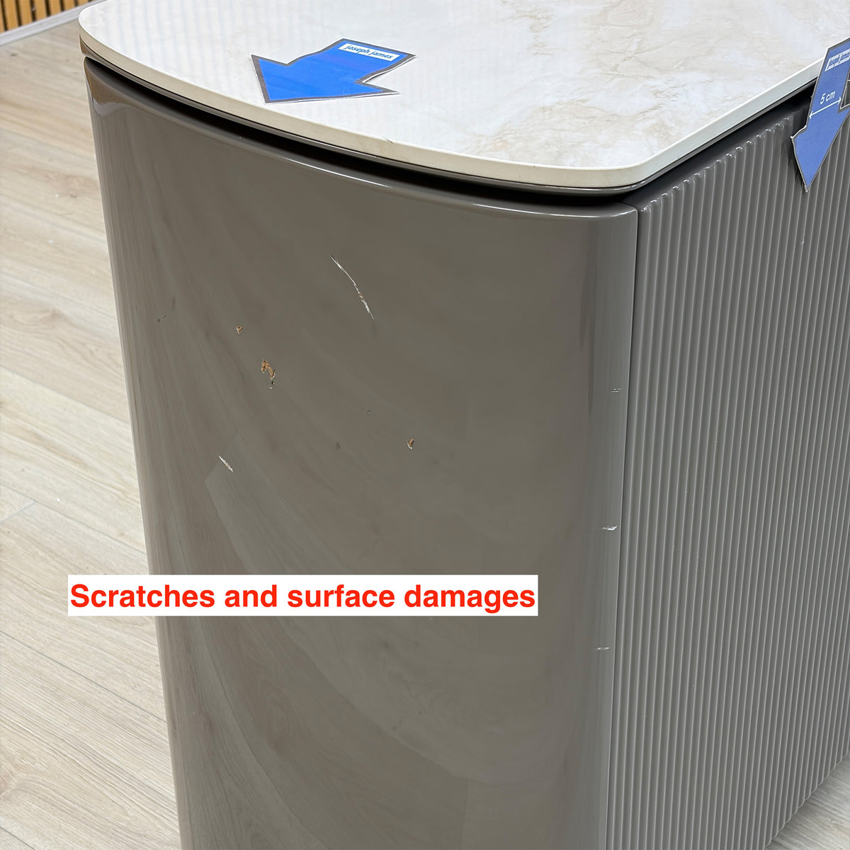 Ivy grey sideboard curved end panel with scratches and surface damage, marked with arrows