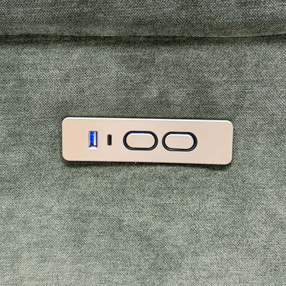 Close-up of the Berlin forest green recliner sofa power control panel with USB ports and two buttons