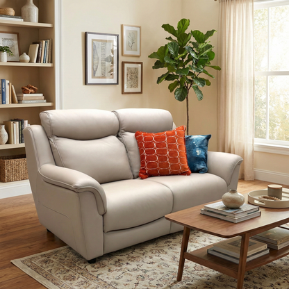 Lifestyle photograph of the light beige leather 2-seater sofa in a home setting, emphasizing its elegant presence and high-quality finish.