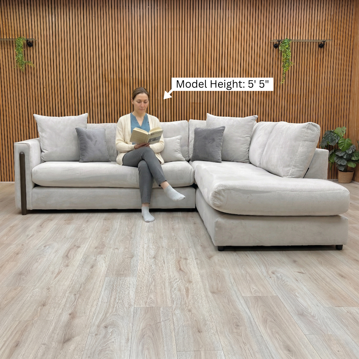 Lifestyle view of the Barney corner sofa, showing the formal back design and deep, comfortable seat cushions.