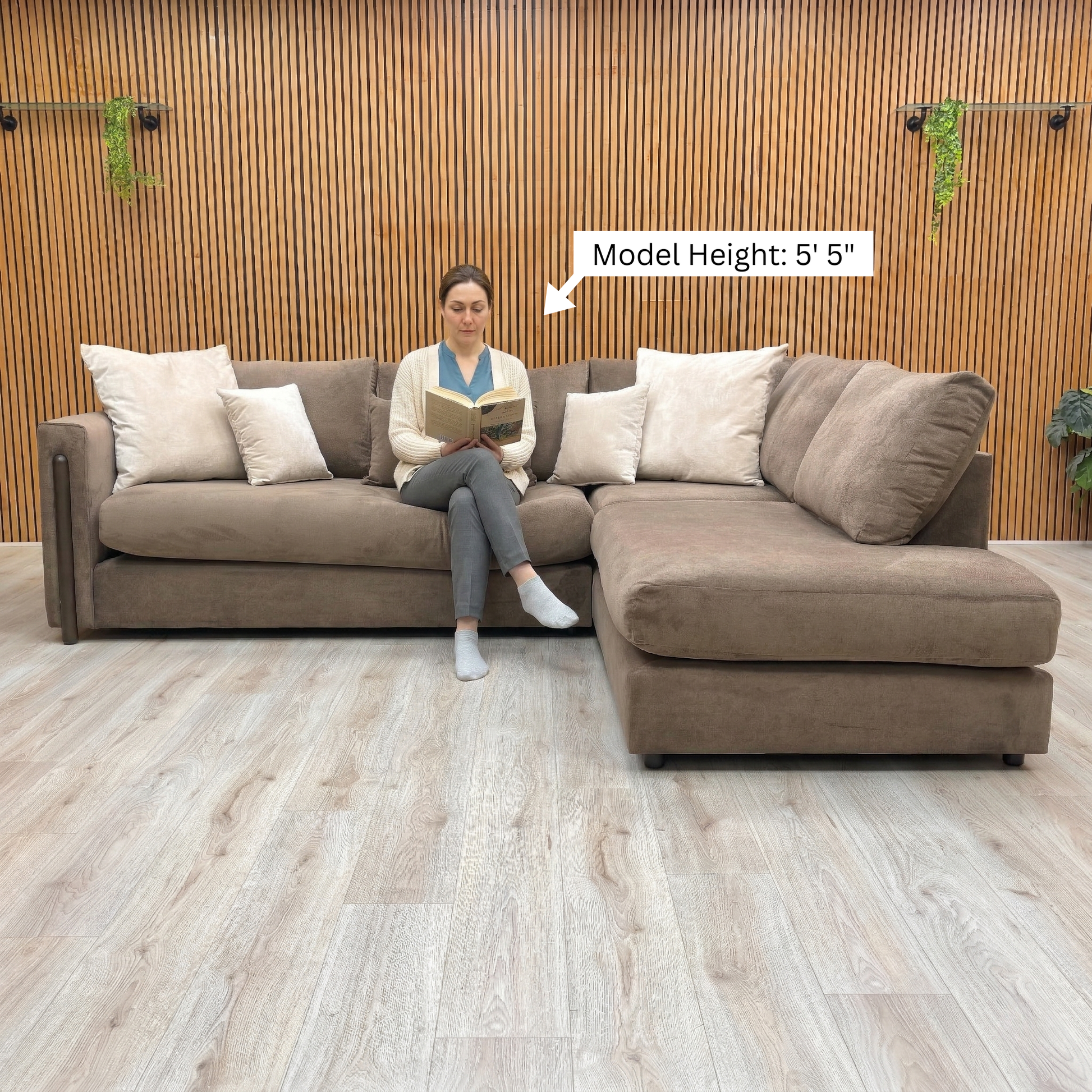 Lifestyle view focusing on the formal back cushions and structured armrests of the Barney sofa.