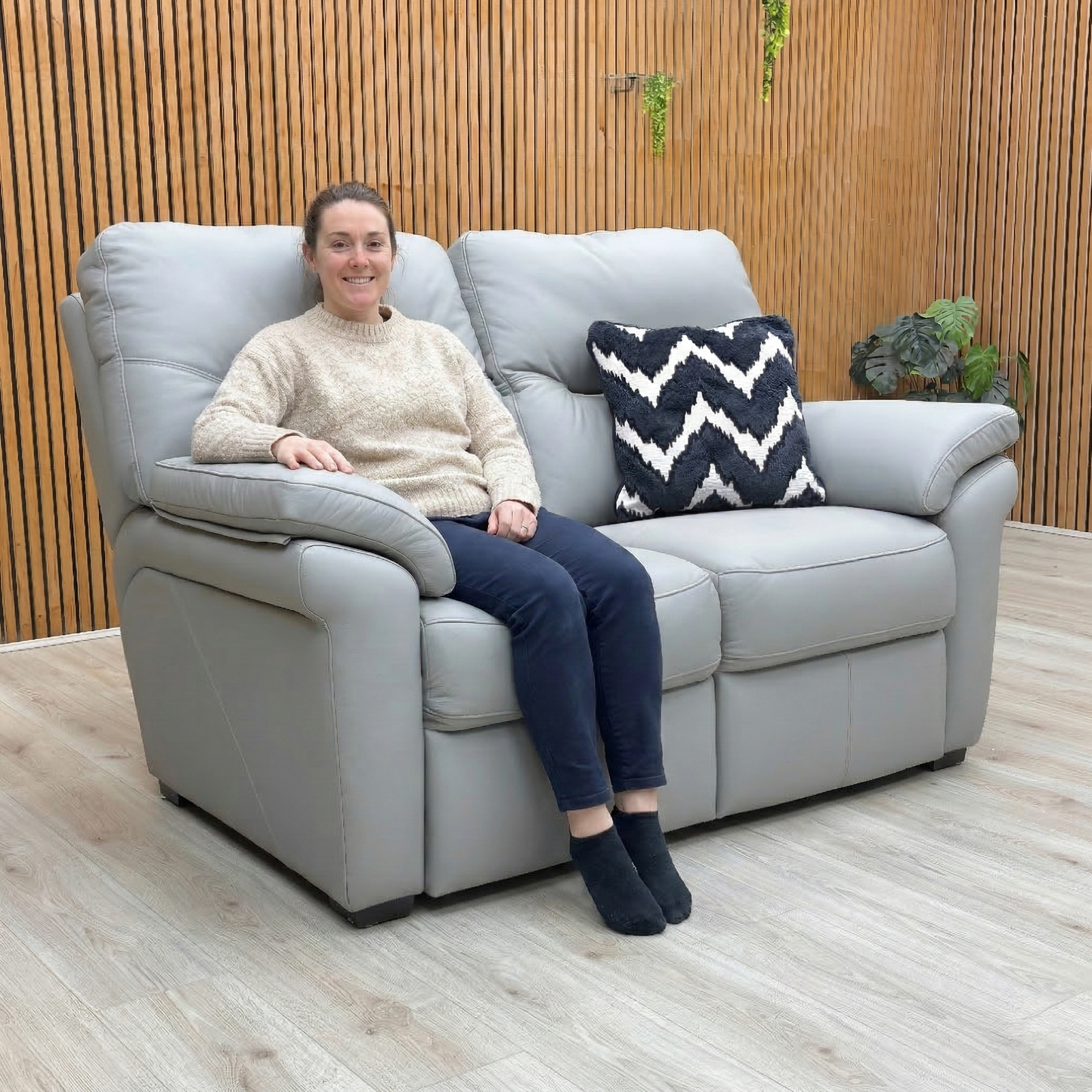 Lifestyle photo showcasing the contemporary silhouette and comfortable curves of the Seattle 2 seater sofa.