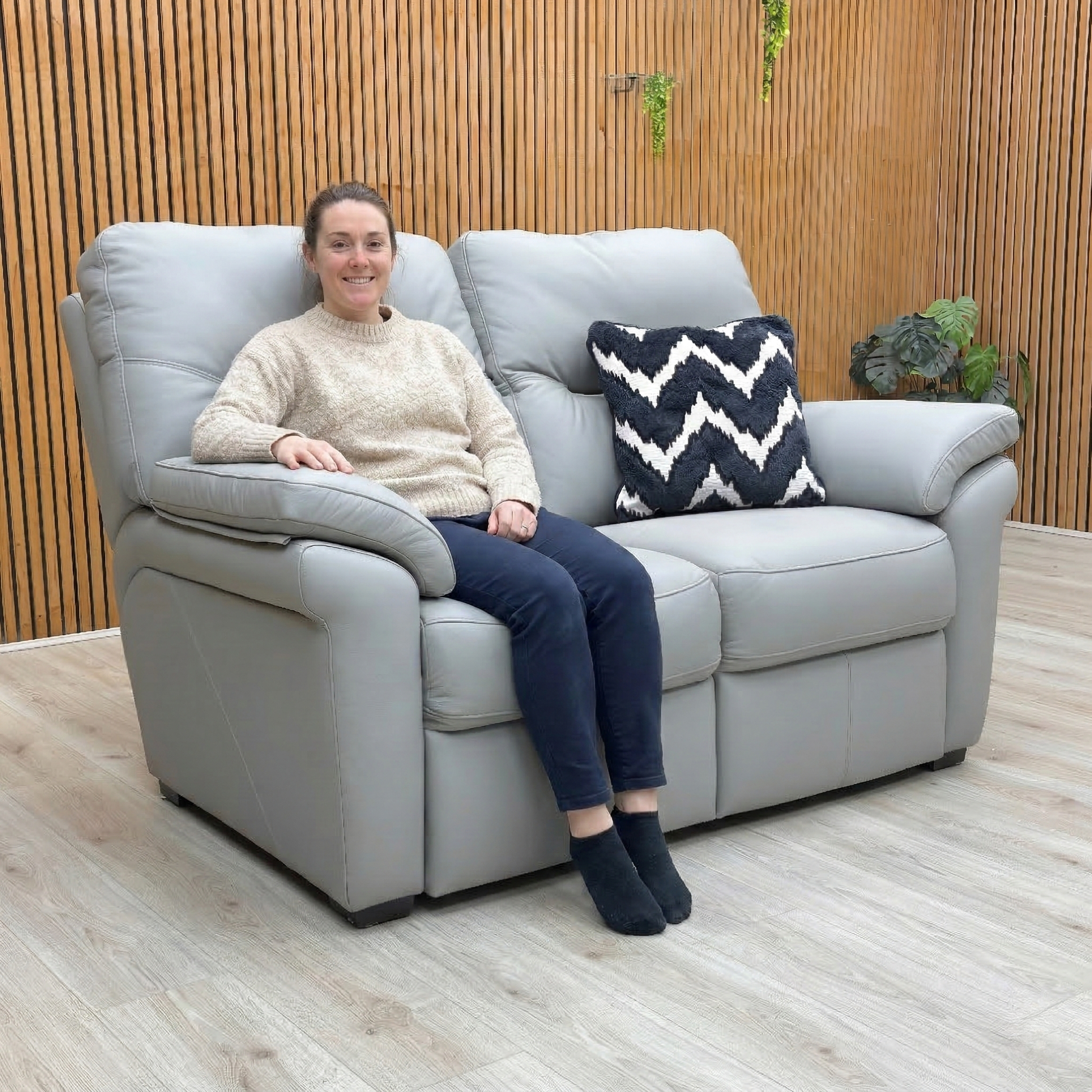 Lifestyle photo showcasing the contemporary silhouette and comfortable curves of the Seattle 2 seater sofa.