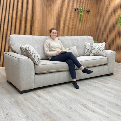 Lifestyle image of the Harvey 4-seater sofa in truffle brown within a modern lounge setting.
