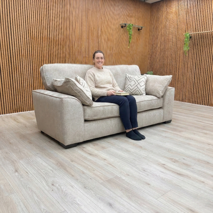 Lifestyle photo of the Harvey 3 seater sofa, showcasing the warm truffle tone and textured soft weave fabric.