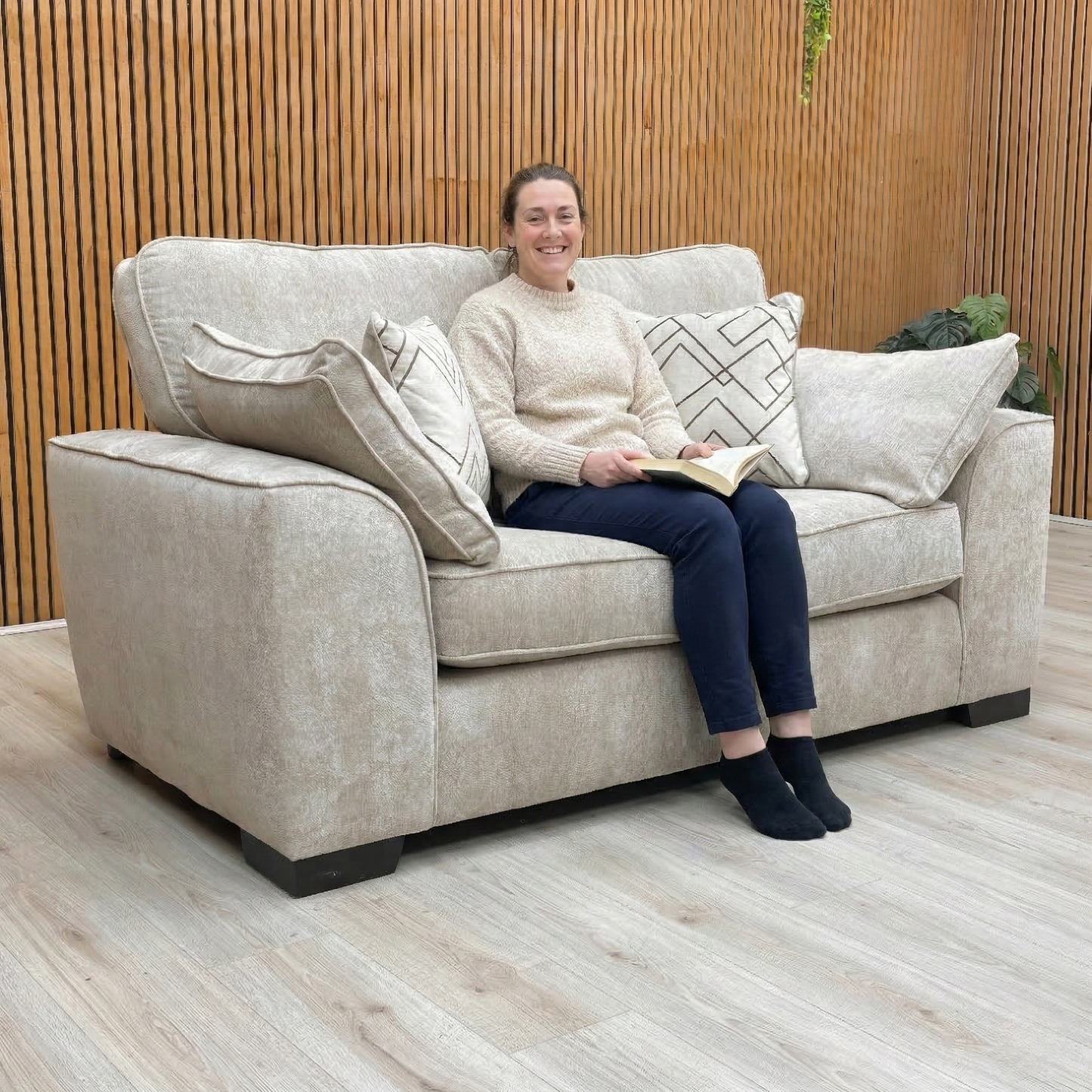 Lifestyle shot of the Harvey 2 seater sofa, highlighting the rich truffle tone and tactile soft weave fabric.