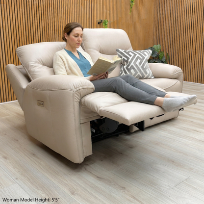 Lifestyle view of the G Plan Amesbury sofa with power recliners fully extended and headrests adjusted.