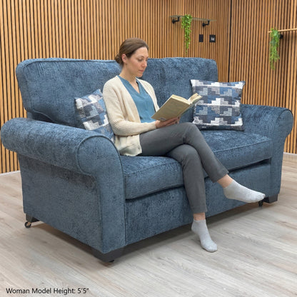 Lifestyle view of the Hedingham sofa bed in Neptune Blue, showcasing the plush seating surface and the sophisticated, timeless silhouette.