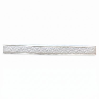 Side view of the double mattress, showcasing the clean white aesthetic and the depth of the quilted layers designed for everyday comfort.
