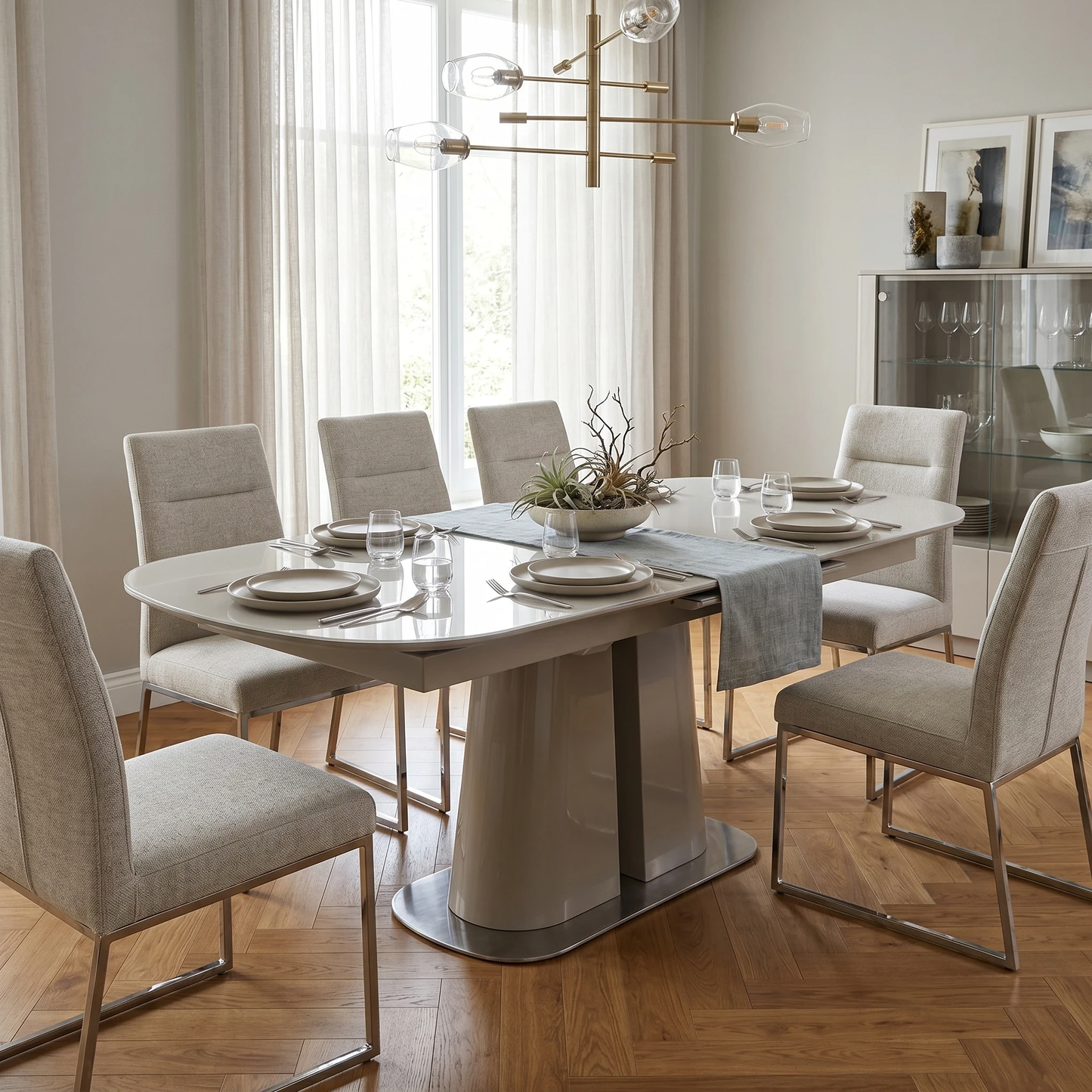 Dining room view for the Cashmere dining table, highlighting its durable construction, versatile design, and convenient central pop-up extending mechanism.
