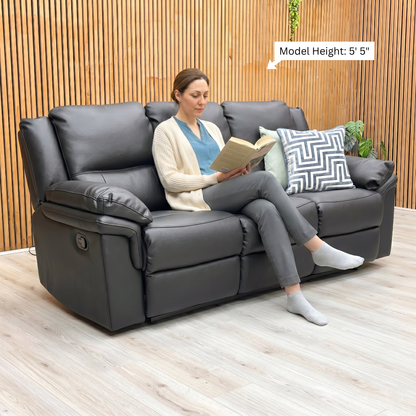 Lifestyle or perspective shot of the Albion sofa in black faux leather, showcasing its sophisticated silhouette and comfortable seating surface.