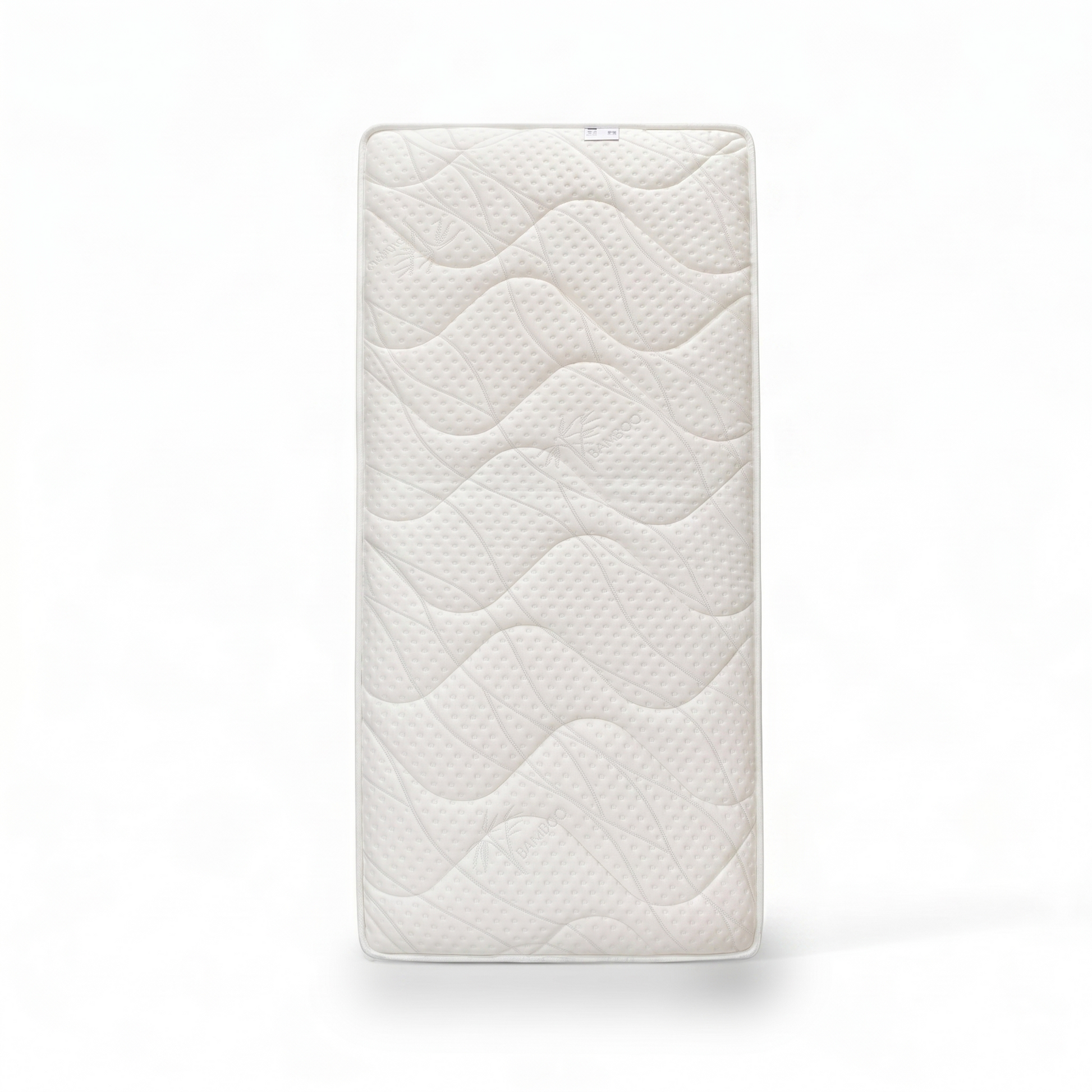 Kudos 2000 Pocket Sprung Mattress Single, top view of white quilted wave-patterned cover