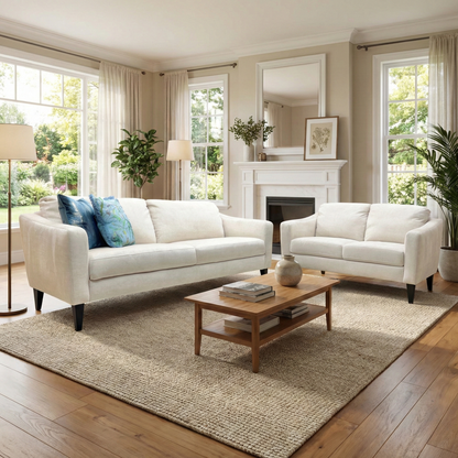 Lifestyle view of the Oslo Vogue sofa set, showcasing the elegant cream velvet upholstery and modern silhouette in a bright living room.