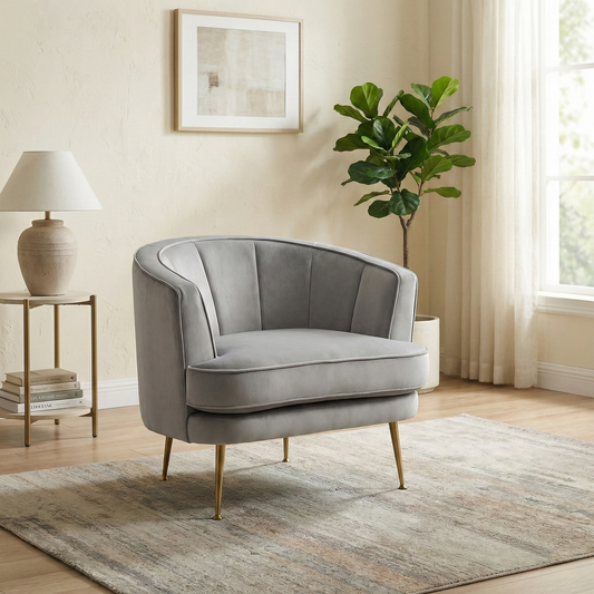 Living Room shot of the ‘Enchanted’ silver velvet chair, highlighting the luxurious shimmer of the fabric and elegant silhouette.