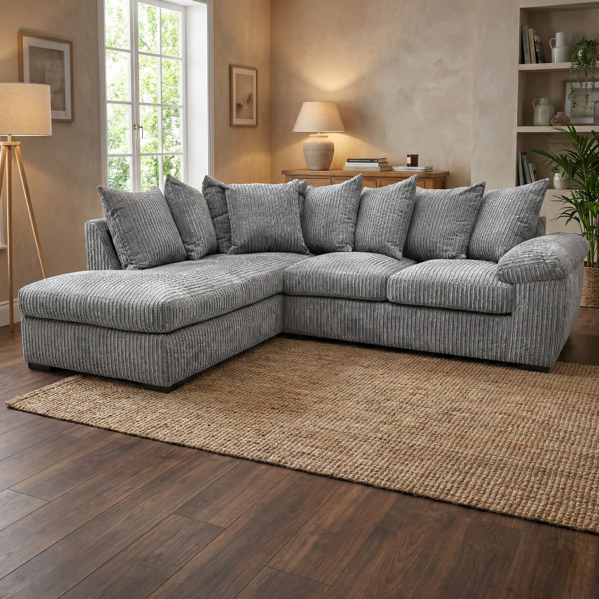 Living Room shot of the ‘Amalfi’ charcoal cord sofa, highlighting the left-hand chaise extension and textured fabric.