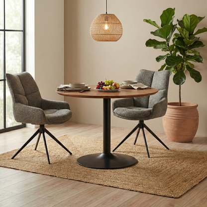 Modern dining room setup featuring a pair of Kiara Ash fabric swivel chairs at a dining table.