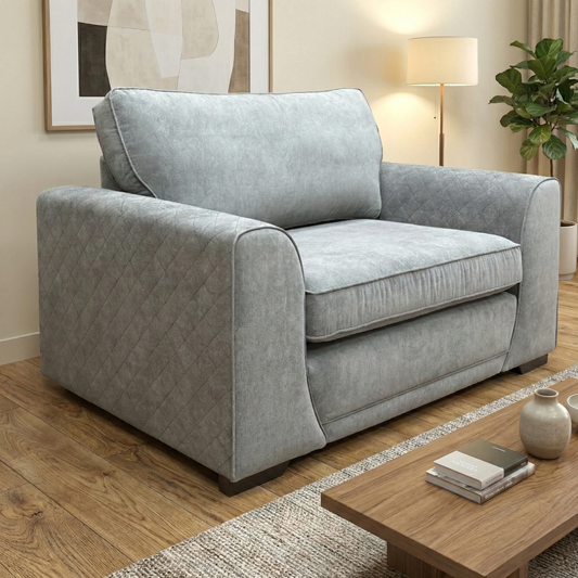 Living Room view of the ‘Orka’ graphite grey chair highlighting the deep seat and plush back cushions.