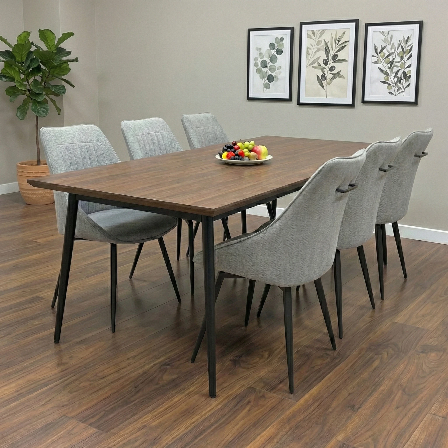 Dining Room view of a silver fabric swivel chair highlighting the elegant curved silhouette.
