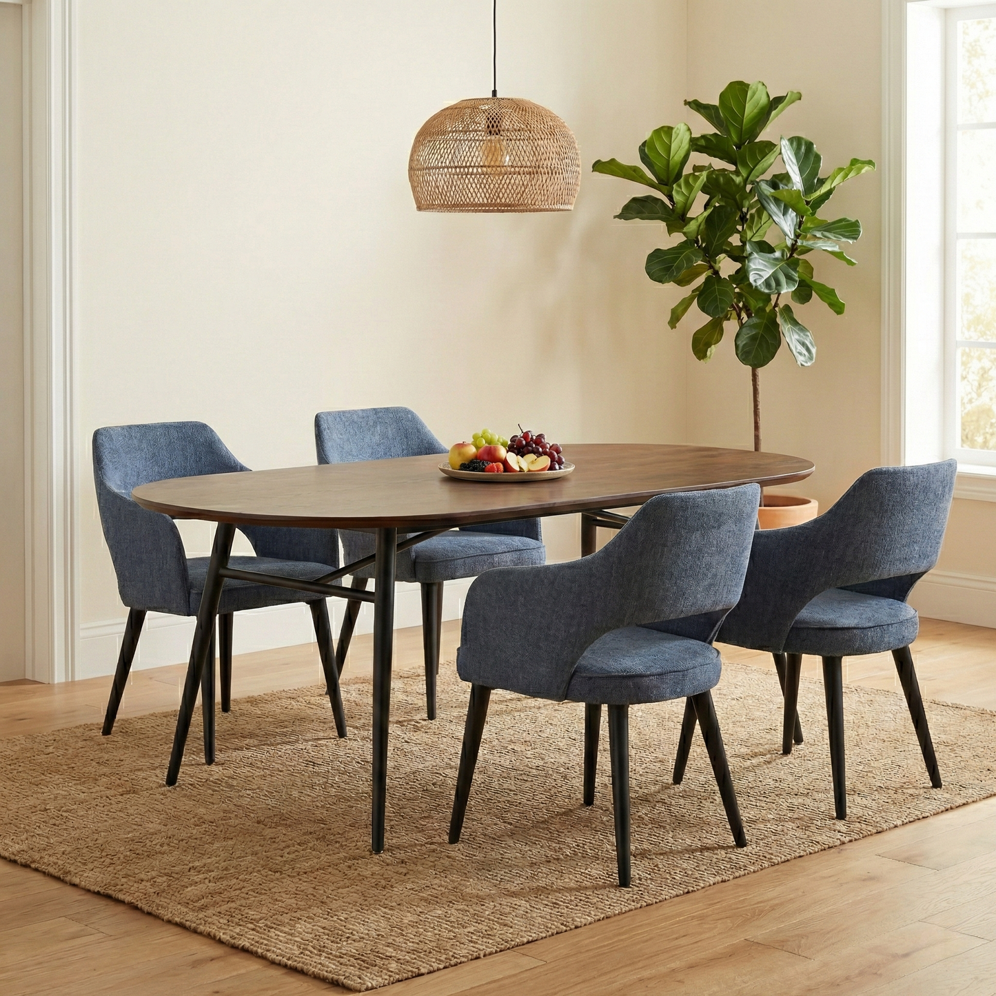 Dining Room view of the ‘Manu’ navy blue upholstered chair, highlighting the contemporary curved backrest.