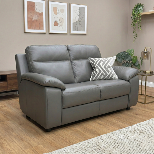 Living room view of the Pepino sofa in Dark Grey leather, showcasing the luxurious cushioned surface and the modern, sophisticated aesthetic of the Italian design.