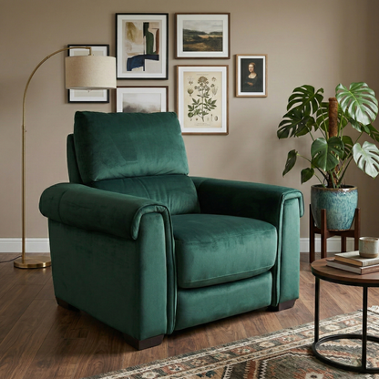 Living room view of the Nixon armchair, showcasing the rich jewel-toned fabric and the plush, comfortable seating surface.