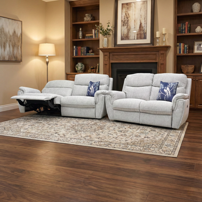 Living Room view of the Ashton 3-seater power recliner in Bariba Grey, showcasing the plush cushioning and sleek chrome detail on the armrests.