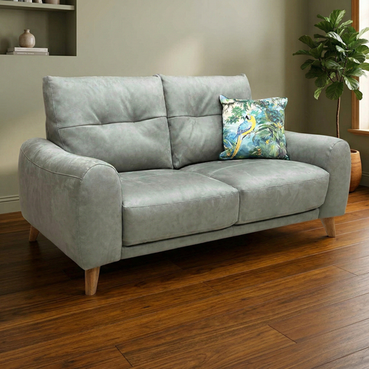 Living room of the Malmo 2-seater sofa, highlighting its handcrafted quality, sprung support, medium comfort level, and Scandi design.