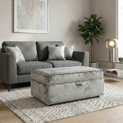 Living room view of the Sasha footstool, showcasing the soft-touch fabric texture and its versatile use as a coffee table, extra seat, or leg rest.