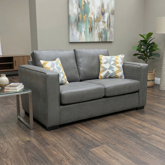 Living room view of Grey snake faux leather Newton sofa bed styled in a contemporary living room, highlighting its compact and functional silhouette.