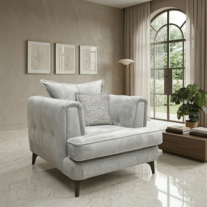 Living room view for the Farrah armchair, highlighting the dual-fabric Riga Silver and Zena Silver upholstery, high-resilience foam seating, and durable timber frame.