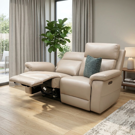 Living room view for the Raven Oslo 2-seater leather sofa, highlighting the pocket-sprung seat interiors, body-hugging curves, power reclining mechanism, and high-quality leather finish.
