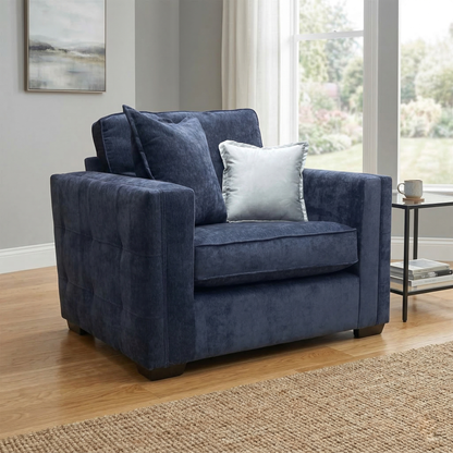 Living room view of the Chelsea love chair, highlighting the rich texture of the denim blue chenille and the traditional curved silhouette.