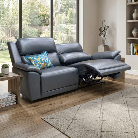 Living room view of the navy blue leather Utah sofa in a modern living room setting.