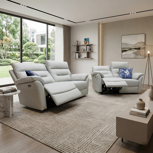 Living room view image of the Sally grey leather sofa set in a modern, neutral-toned living room with soft lighting.