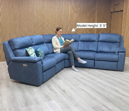 Lifestyle view of the corner section, showcasing the generous seating area and the rich, vibrant tones of the Stingray Indigo velvet fabric.