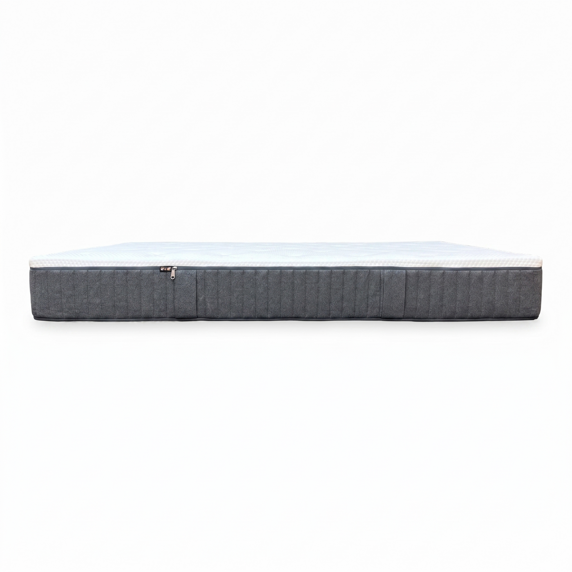 Side view of the Emma Original king-size mattress styled on a modern low-profile wooden bed frame in a bright, minimalist bedroom setting.