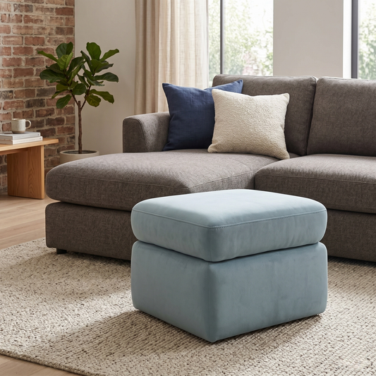 Living room of the Cinemax footstool with the lid open, revealing the deep internal storage compartment and smooth hinge mechanism.