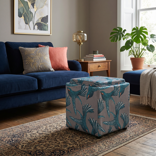 Living room of the storage cube, showcasing the detailed grey and white patterned upholstery and structured square shape.