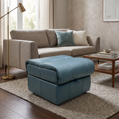 Living room of the Moreno footstool with the lid open, revealing the deep internal storage compartment and sturdy hinge mechanism.