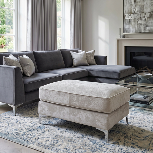 Living room of the Kingston footstool, highlighting the plush cushioning and the clean upholstery finish on the side panels.
