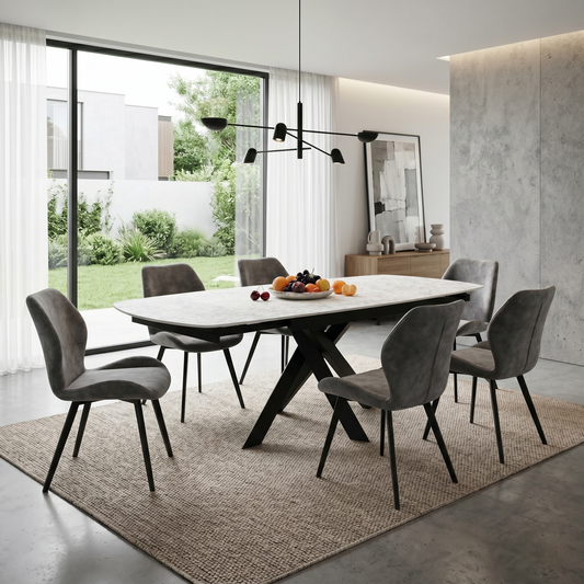 Dining room view for the Warrior extending dining table, highlighting the durable sintered stone surface, smooth 360-degree swivel mechanism, and modern luxe aesthetic.