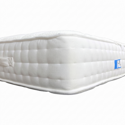 Edge profile of the mattress, emphasizing the multi-layered construction and the reinforced edge-to-edge support system.