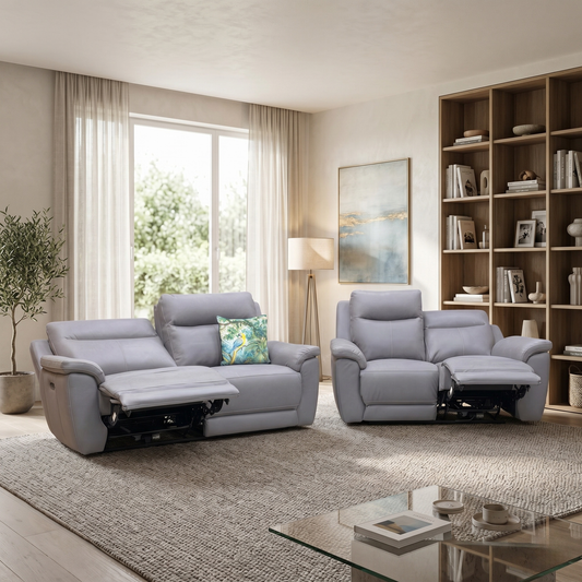 Living room view for the Bobby Cat sofa set, highlighting the premium natural hide leather, smooth power reclining mechanism, and integrated USB charging ports.