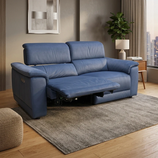 Living room view for the Genius Bella Navy Velvet sofa, highlighting the power adjustable headrests, USB charging ports, and plush velvet upholstery.
