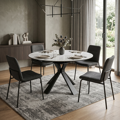 Dining room view of the Crete table in its compact round configuration, showcasing the sleek 120cm diameter and contemporary industrial design.