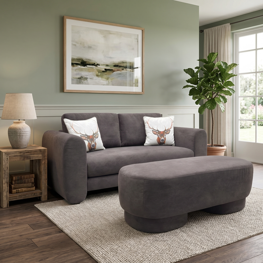 Living Room view of the Mazetti 2-seater sofa in praline brown fabric, showing its clean lines, padded armrests, and modern aesthetic.