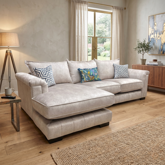 perspective showing the wide chaise section extending forward on the left side, designed for optimal lounging comfort.